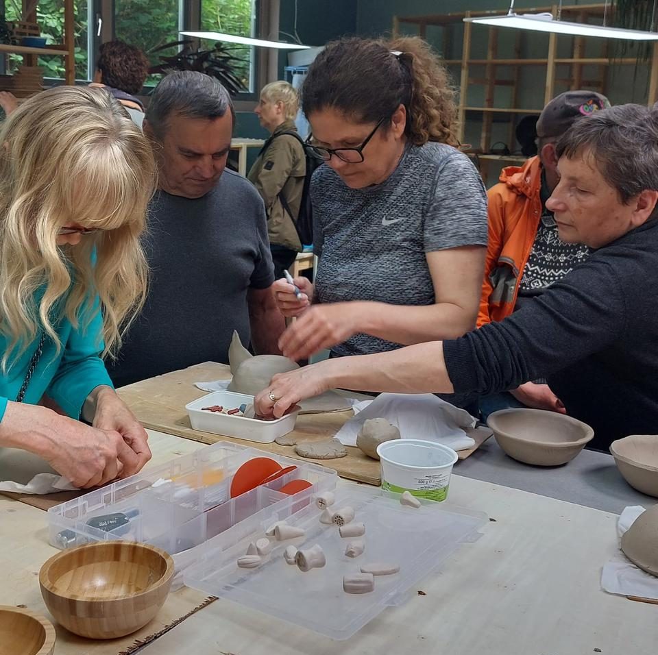 Potters hand building in pottery studio